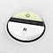 Round, white button with black symbols and the inscription R.