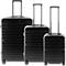 Trois valises noires de différentes tailles sont côte à côte. Elles ont une surface nervurée et des poignées extensibles.