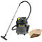 A grey Karcher vacuum cleaner with accessories, consisting of hose, suction tube and bags. Next to it are spare bags.