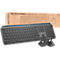 Gray keyboard and mouse set in front of brown cardboard box. Print: MX KEYS COMBO.
