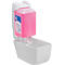 White soap dispenser with pink liquid soap and collection container. Label with text.