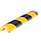 Yellow and black corner protector, formed as a semicircle.
