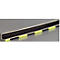 Close-up of an L-shaped bar with yellow markings. It lies on a gray background.