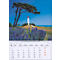 Calendrier de juillet 2027 avec un phare et des plantes en fleurs. Le bleu et le vert dominent l'image.