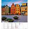 Maisons colorées à Stockholm, en Suède, avec des jardinières au premier plan et un calendrier mensuel.