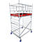 Metal scaffolding with red platform. Blue rolling wheels on the feet.