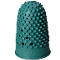 Green thimble with bumps, holes, and lettering on the edge.