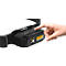 A black headlamp being activated with a finger. The headlamp has a yellow light.
