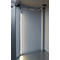 Inside view of a cabinet with LED light. Gray metal walls and frames. A white cable leads to the ceiling.