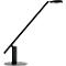 Black desk lamp with a round light head. The long, thin arm is angled upwards.