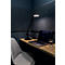 Desk with lamp, laptop, glass of water and chair. Dark background.