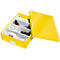Yellow, open box with compartments, filled with office accessories, lid next to it.