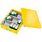 Yellow open file box, with medication in compartments. The lid is next to it.
