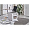 White paper shredder on a desk. In the background an office with plant, desk and cabinet.