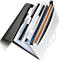 Open white file folder with black edges, filled with documents and a spiral notebook.