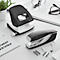 Black and white hole punch and stapler by Leitz on a desk.