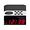 Nahaufnahme eines digitalen Radioweckers mit roter LED-Anzeige 12:38 und Bedientasten oben.