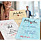 Close-up of three gift vouchers with heart motifs. In the background a smiling woman and a blurred person.
