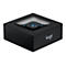 Schwarzer quadratischer Logitech Bluetooth-Adapter mit beleuchteter Taste auf weißem Hintergrund.