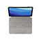 Graues Tablet mit Tastatur, Stift, blauem Wellen-Hintergrund. Oben ein Stift angedockt.