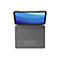 Draufsicht auf Tablet mit Tastatur und Stift. Display mit blauem Wellenmuster. Graue Tastatur mit Touchpad.