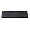 Schwarze Logitech Wireless Tastatur mit integriertem Touchpad und gelbem Akzentknopf.