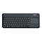 Schwarze kabellose Logitech-Tastatur mit integriertem Touchpad rechts auf weißem Hintergrund.