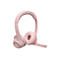 Casque rose clair avec microphone sur fond blanc.
