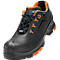 Black safety shoe with orange details. Uvex logo, laces, and sole.