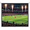 Beamer-Leinwand mit Fußballspiel-Übertragung und Feuerwerk im Stadion.