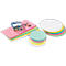 Stacks of colored sheets, green and white circles, colored push pins and a container with more push pins.