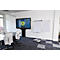 Conference room with table, chairs, screen and flip chart with diagram.