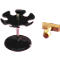 Black pen holder and wooden stamp. The pen holder has a round base, a pink rod, and a flower-shaped holder. The stamp is light.