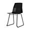 Black chair with geometric back and metal legs. On a white background.