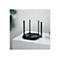 Routeur wifi noir avec quatre antennes sur une table blanche. A côté, un livre, en arrière-plan, une plante.