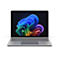 Silberner Laptop, Display mit bunten, geschwungenen Formen. Tastatur und Touchpad sichtbar.