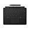 Schwarze Surface Tastatur mit Touchpad und Eingabestift vor weißem Hintergrund.