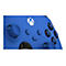 Manette Xbox bleue avec boutons noirs. Le logo est blanc. Les boutons sont marqués de lettres.