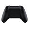 Manette Xbox noire, vue arrière. Xbox est visible au-dessus du couvercle de la batterie.