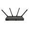 Schwarzer Router mit vier Antennen, mehreren AnschlÃ¼ssen und dem Schriftzug MikroTik. Auf weiÃŸem Hintergrund.