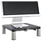 Monitor on black stand with USB stick. Silver frame, display black. Stand with silver legs.