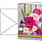 Greeting card with a bouquet of pink gerberas, tulips and daisies. On wood-look background. Envelope next to it.