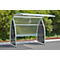 Metal bike shelter with plexiglass walls and roof, in front of green bushes.