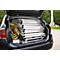 Open trunk of a black car, filled with scaffolding pipes and a toolbox. Box says "MUNK".