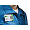 Man wearing a blue work jacket with a name tag "greenboxx" and barcode. The tag says "User Log In".