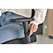 A person adjusting the armrest of a black office chair. The focus is on the hand turning a knob.