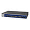 Commutateur Netgear noir avec façade bleue, ports et indicateurs.