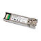 Ein silberner NETGEAR AM734 SFP Transceiver. Der grüne Stecker ist links, der Text ist lesbar.