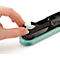 Close-up of a hand inserting a silver stapler head into a green stapler.
