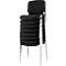 Stacked black chairs with silver metal legs. The backs and seats are padded.
